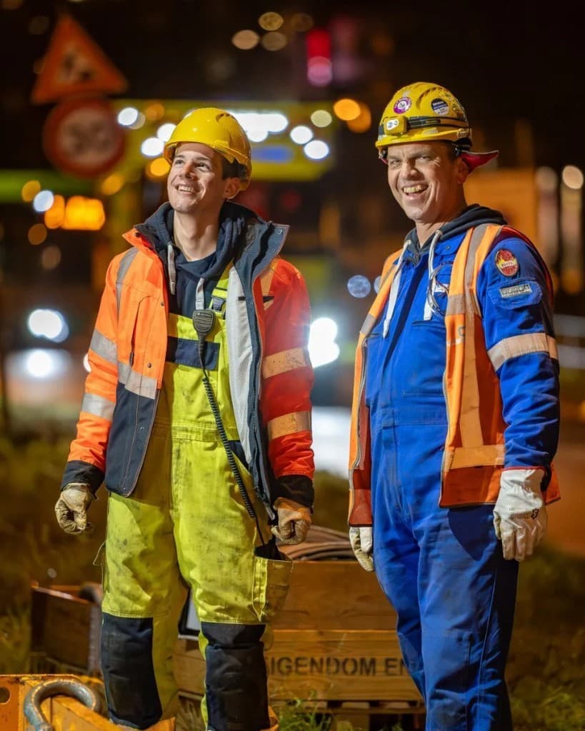 UCM Holland employees in high-visibility workwear on site